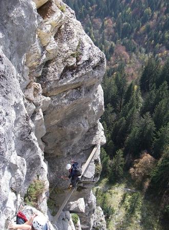 Crossing a high bridge on a Haute Savoie via ferrata