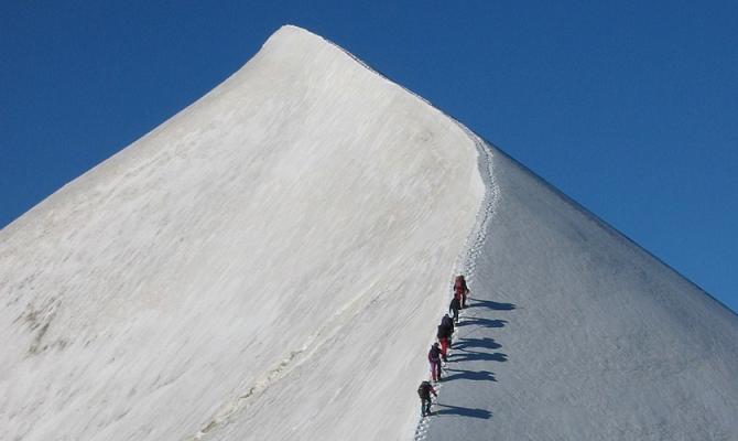 Ascending the arête to the summit of the Domes du Miages