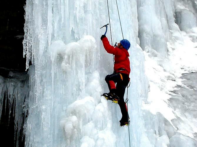 Ice climbing steep waterfall ice