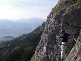 Crossing a cable bridge on a via ferrata