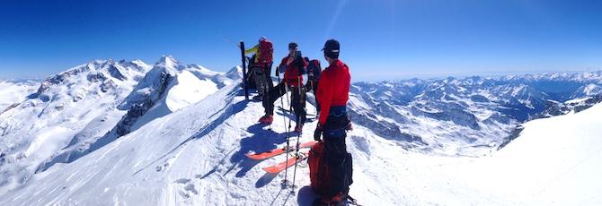 Icicle ski touring group on the summit of Breithorn