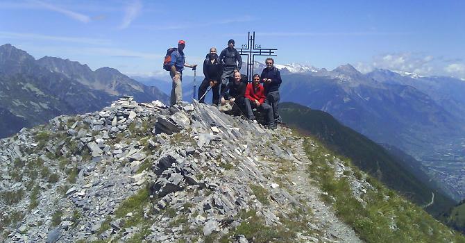 On the summit of the Croix de Fer with the Martigny valley of Switzerland just behind